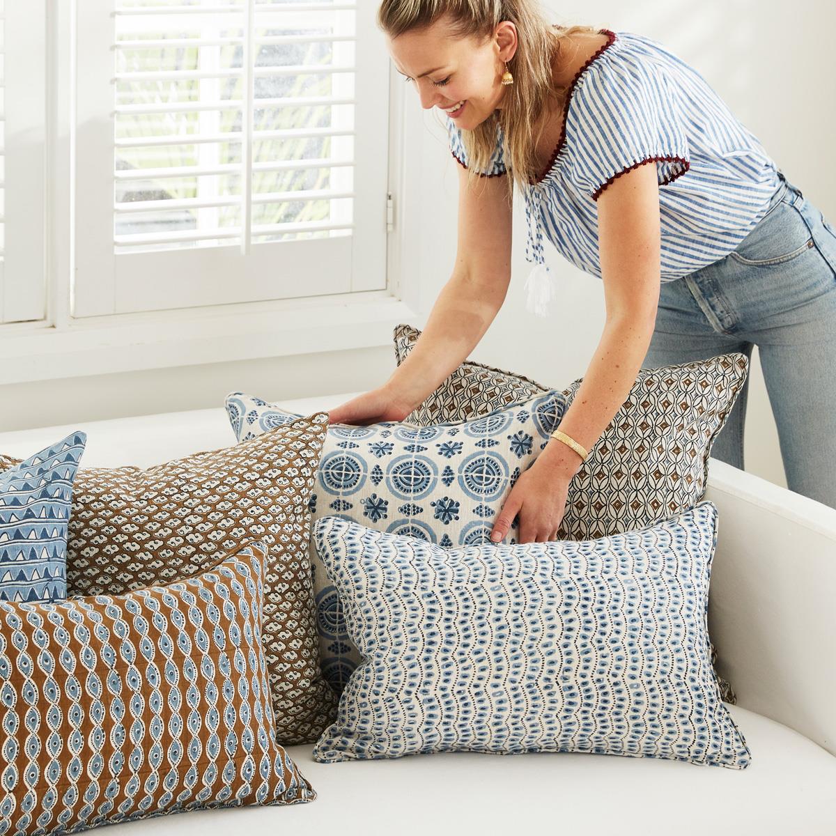 A decorative throw pillow with the Amreli Azure Cushion design from Walter G, hand block printed on 100% linen. Cushion insert included.