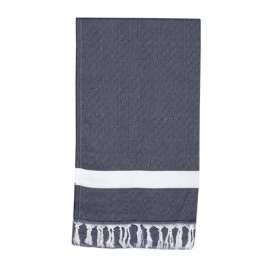 An absorbent navy and white Alanya Towel from Sammimis, with a decorative stripe and tassel fringe, neatly folded and isolated on a white background.