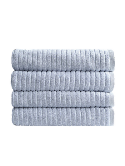 A stack of neatly folded, eco-friendly Alessia Cotton Bamboo Rib bath towels in Fresco Blue by Canningvale.