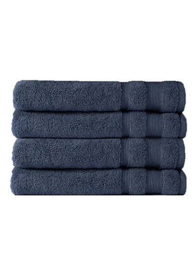 A stack of super-soft Canningvale Amalfitana Bath Towels, in plush navy blue, neatly folded on a white background.