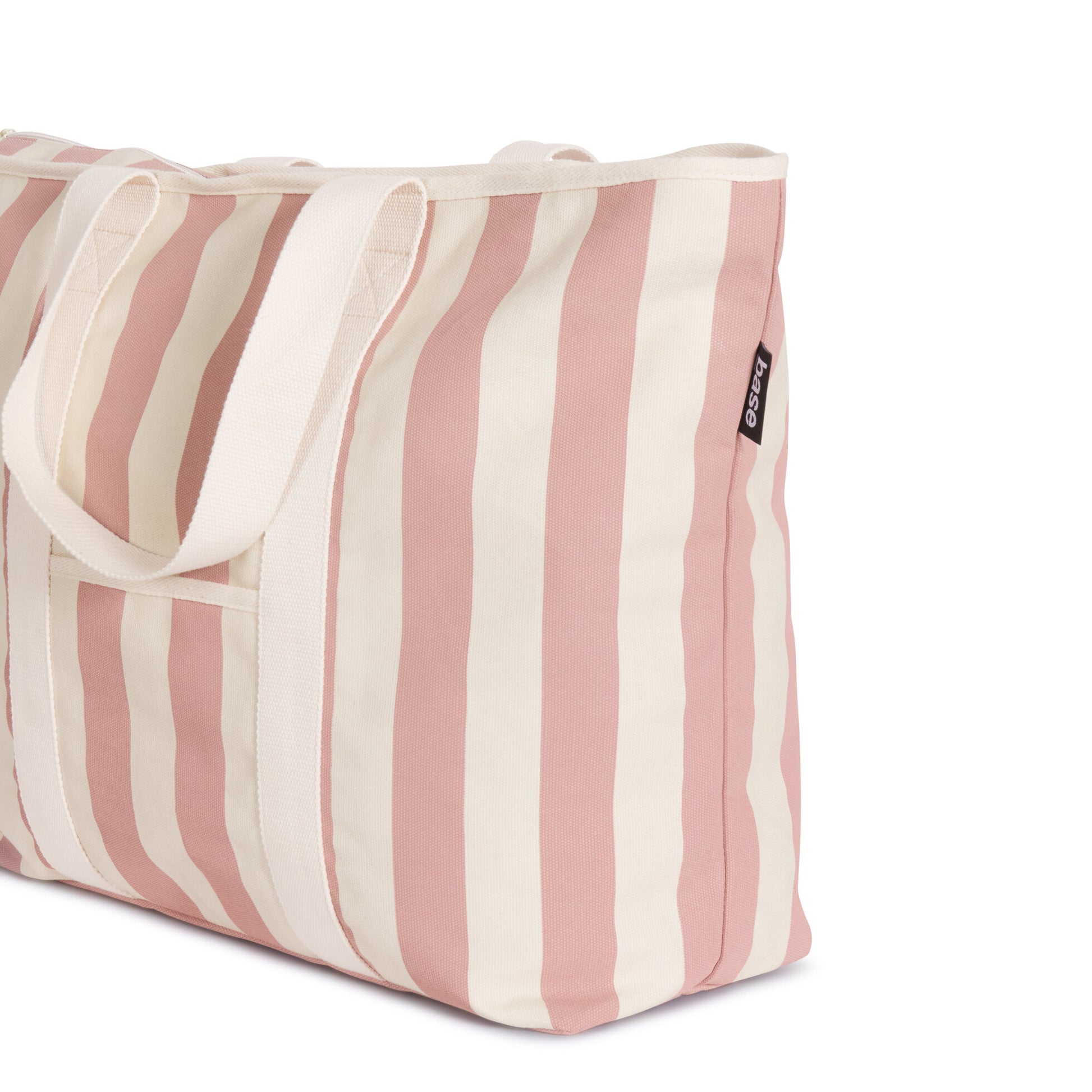 A striped cotton canvas tote bag in shades of beige and pink with durable handles, suitable for casual outings or grocery shopping - All Day Base Canvas Bag in Rosebud Stripe by Base Supply.