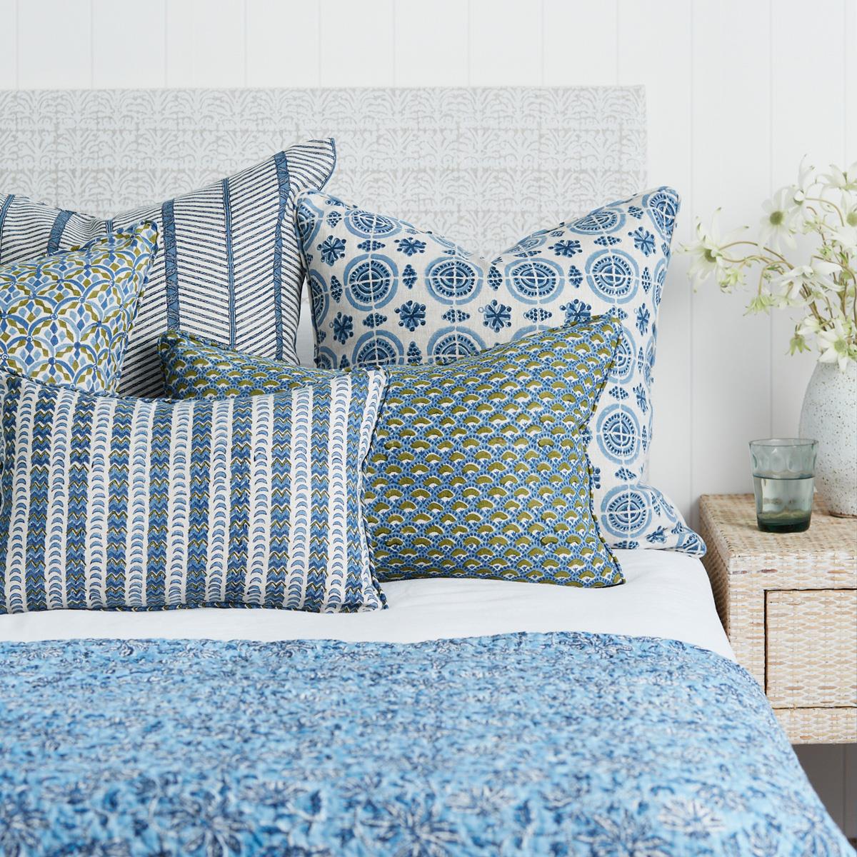 A decorative throw pillow with the Amreli Azure Cushion design from Walter G, hand block printed on 100% linen. Cushion insert included.