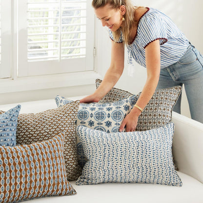 A decorative throw pillow with the Amreli Azure Cushion design from Walter G, hand block printed on 100% linen. Cushion insert included.