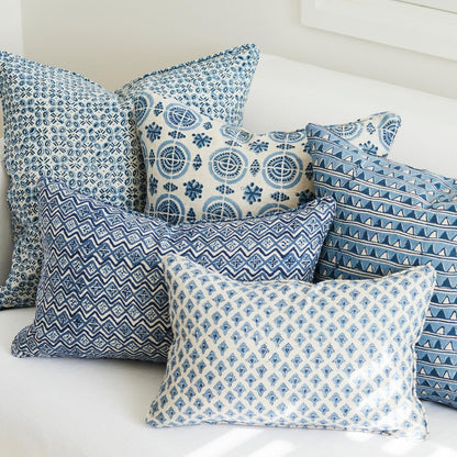 A decorative throw pillow with the Amreli Azure Cushion design from Walter G, hand block printed on 100% linen. Cushion insert included.